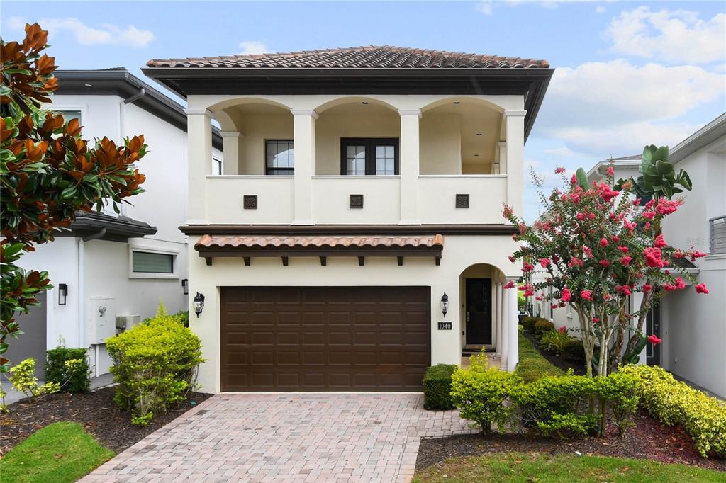 a front view of a house with a garage