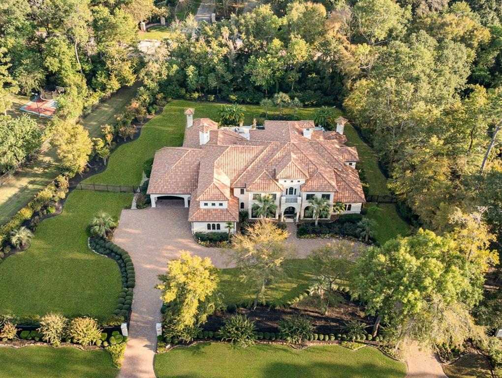 an aerial view of a house with a garden