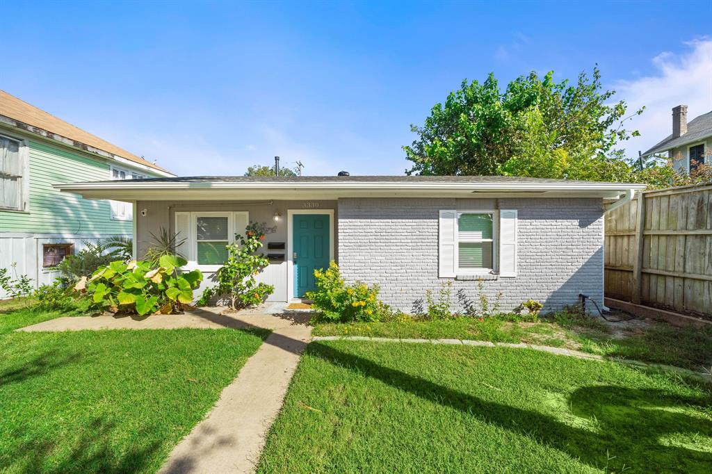 a view of a house with a yard and plants