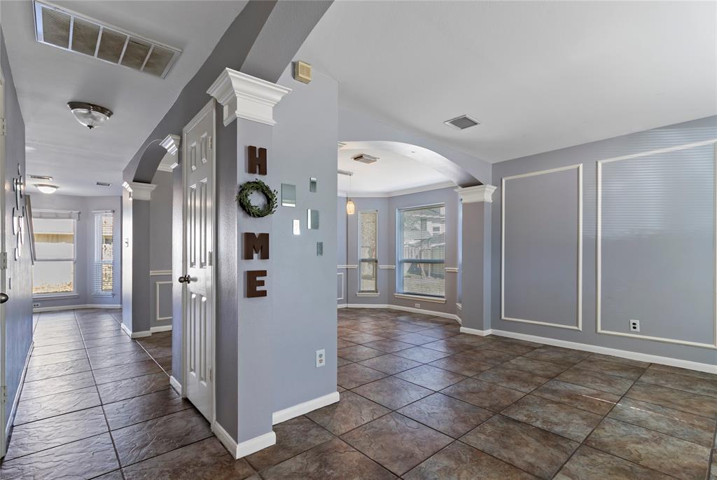 a view of a hallway with wooden shelves