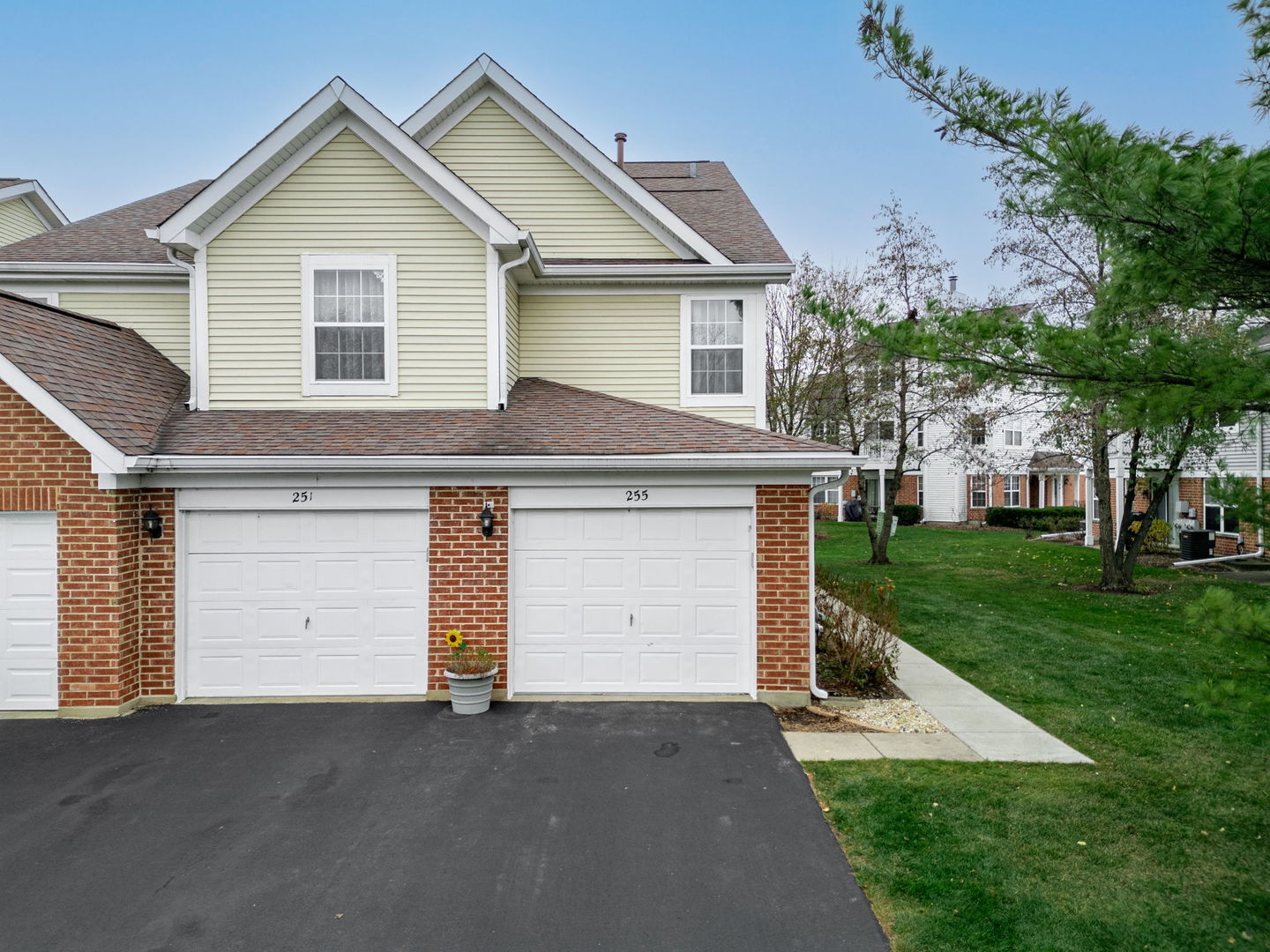 a view of a house with a yard and garage