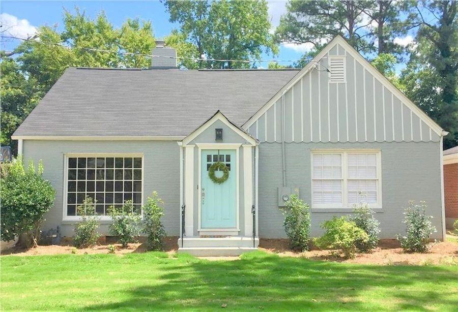 a view of house with yard