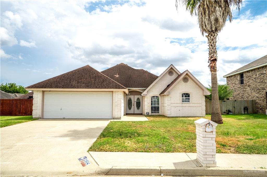 a view of a yard in front of a house with a yard