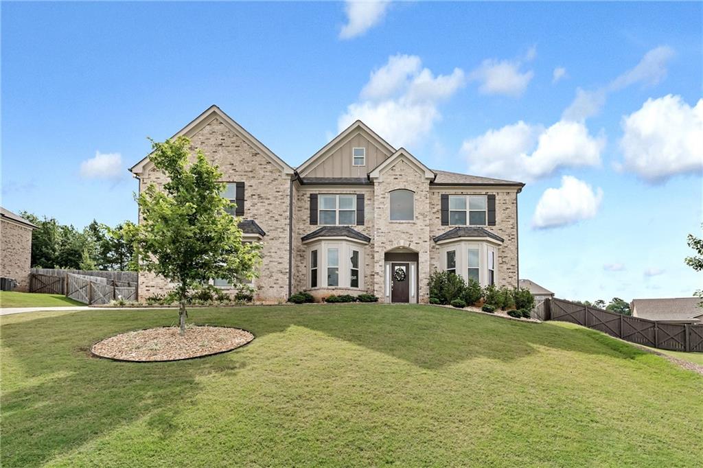 a front view of a house with a yard