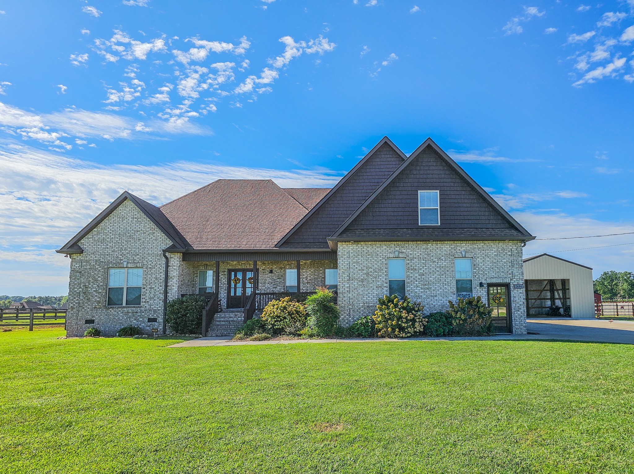 a front view of a house with garden