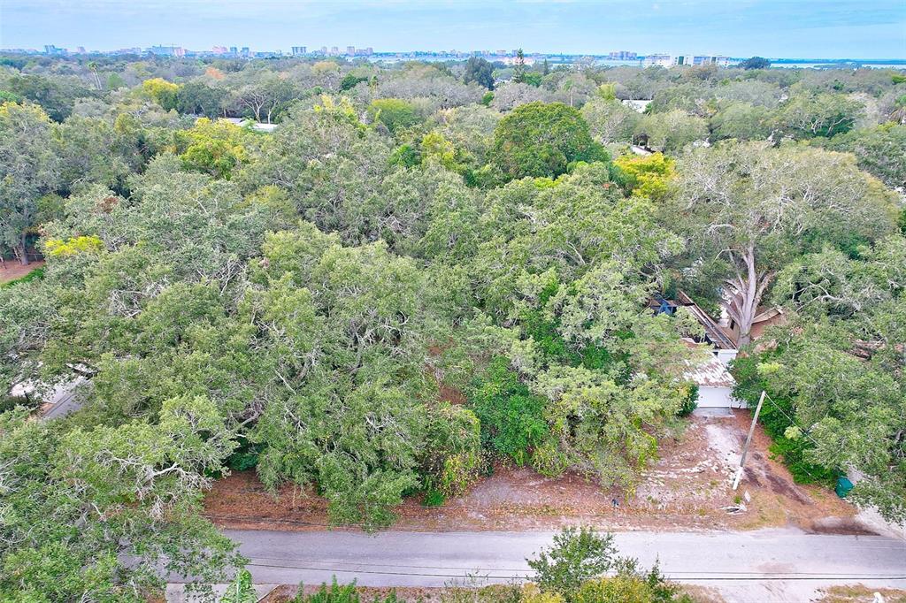 an aerial view of a houses with yard