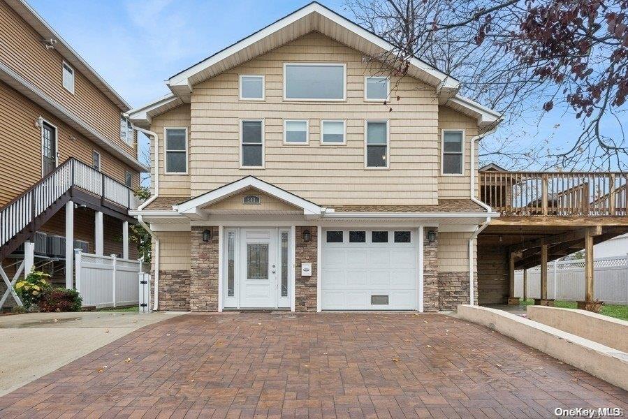 a front view of a house with a garage