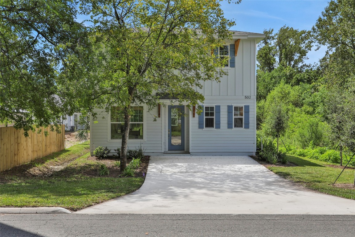 front view of a house with a garden