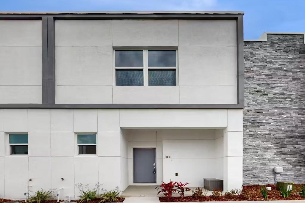 a front view of a house with a garage