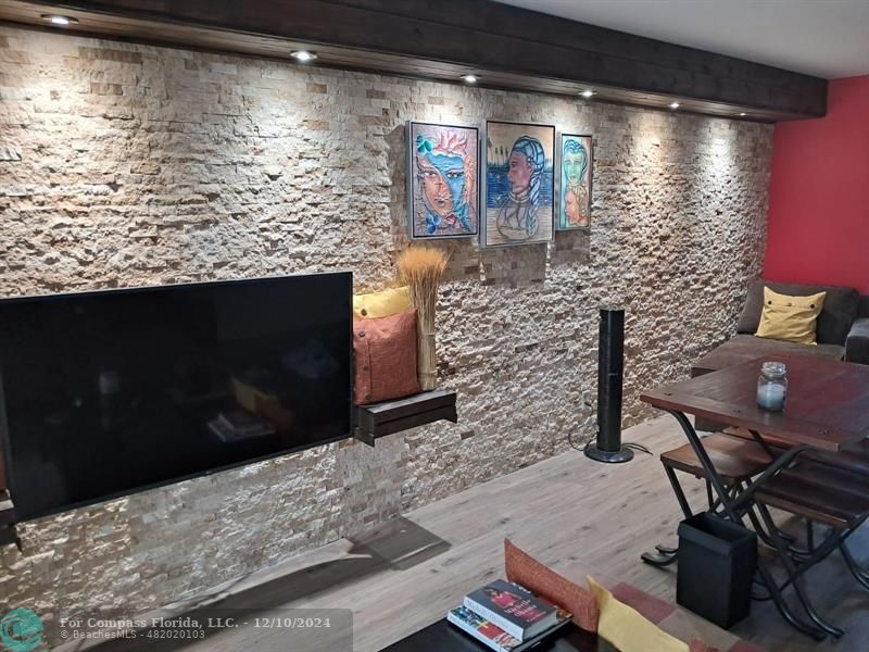 a living room with fireplace furniture and a flat screen tv