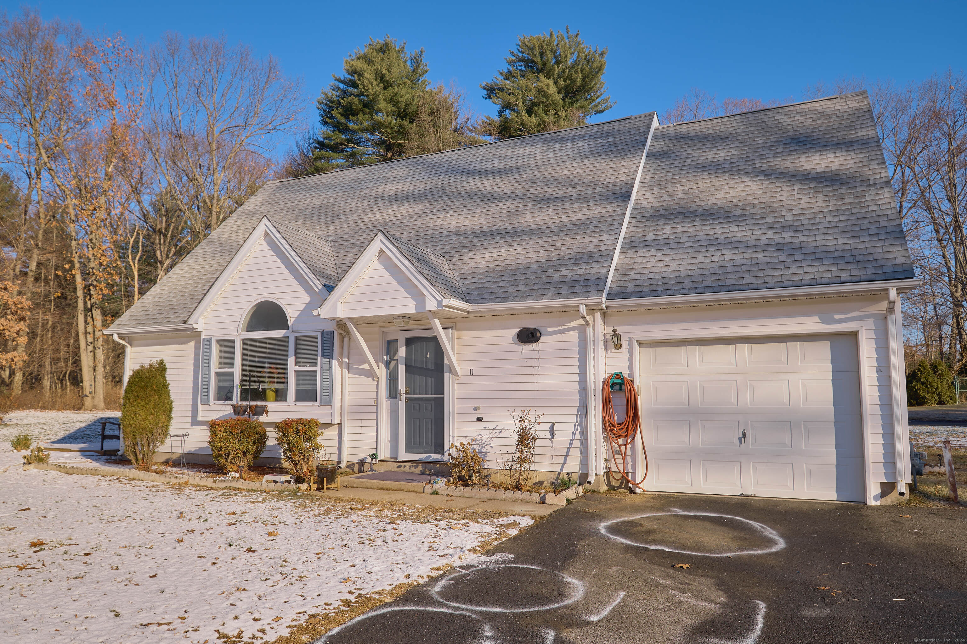 a view of a house with a snow in the yard