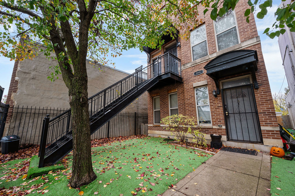 a view of backyard with deck and outdoor seating