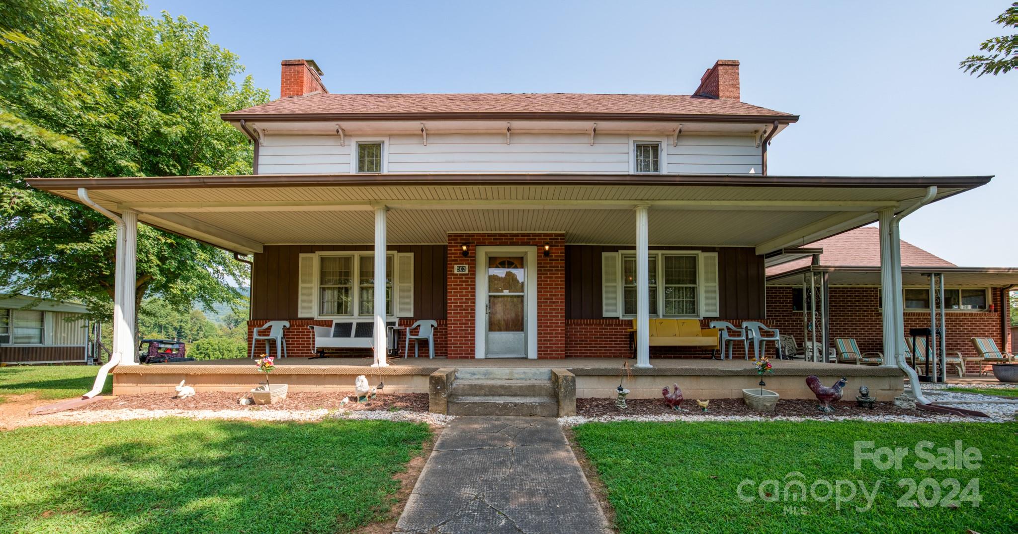 front view of a house with a yard