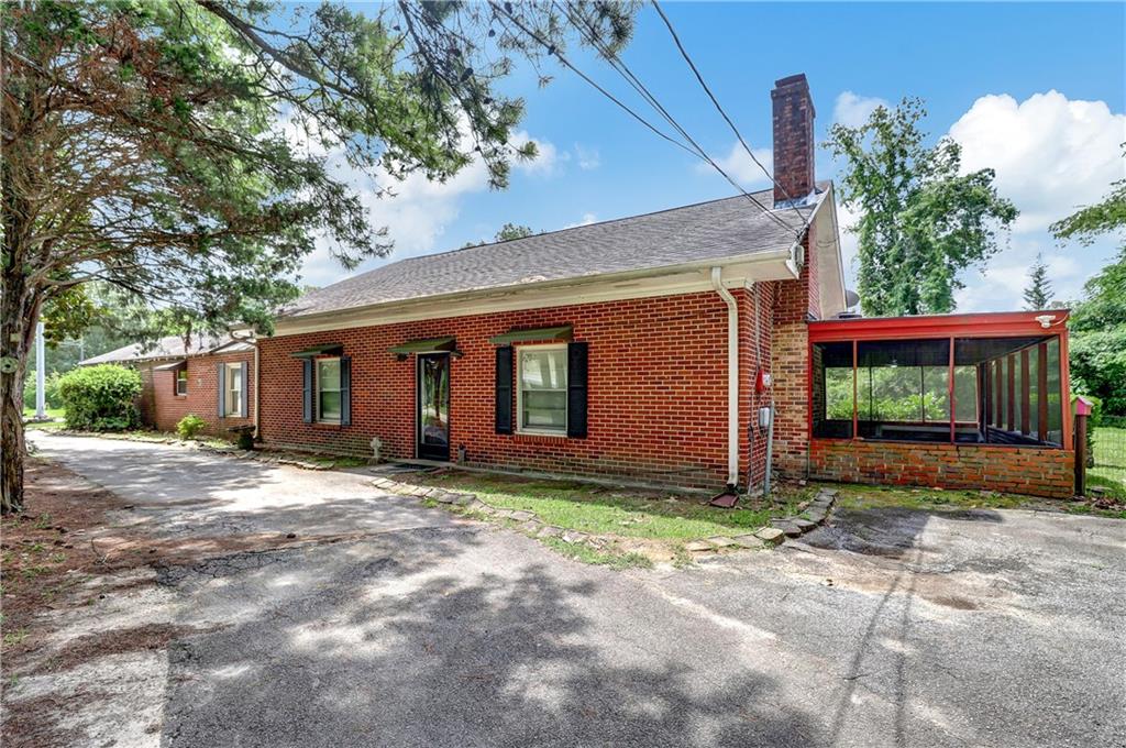 a view of a house with a yard and garage