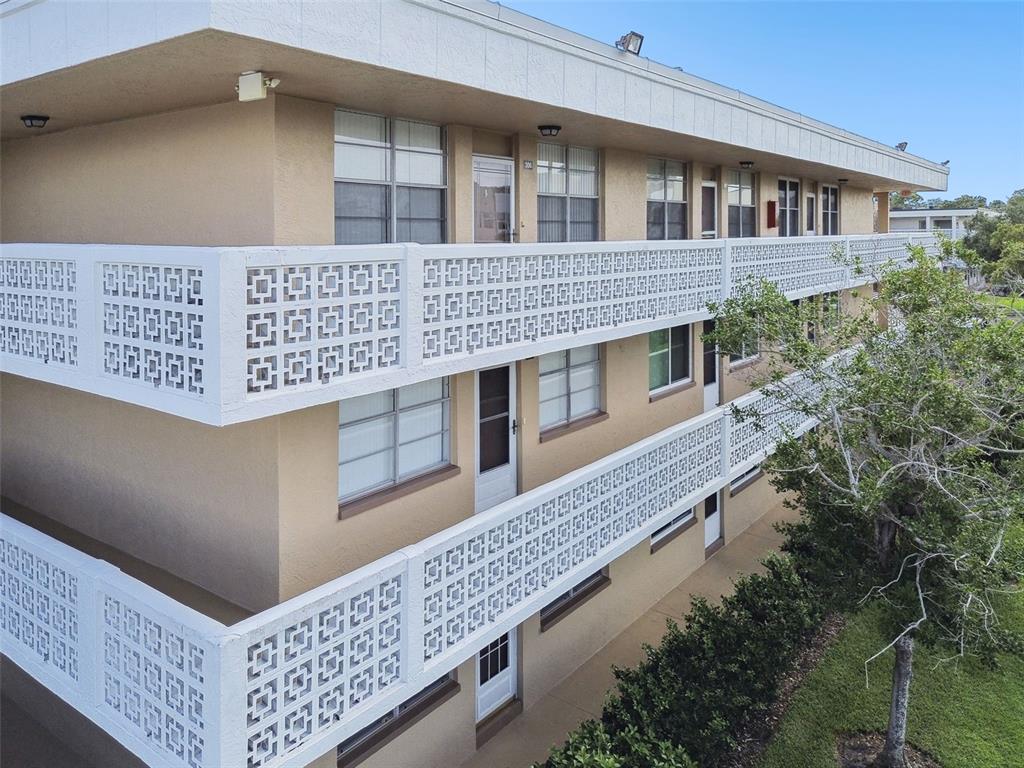 a large building with a large window and balcony