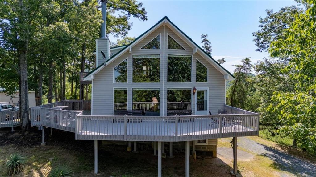 a front view of a house with table and chairs