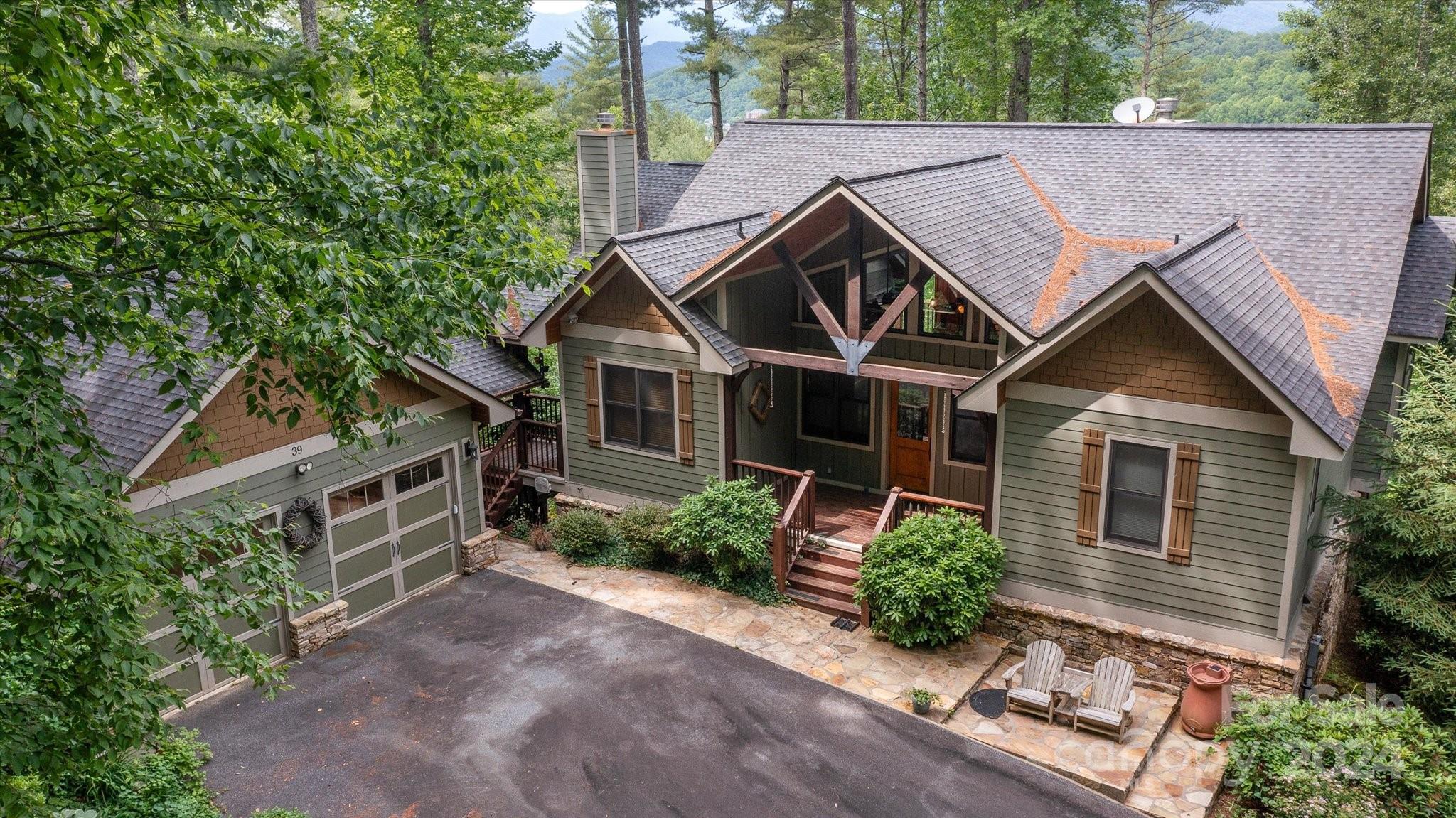 a aerial view of a house with a yard