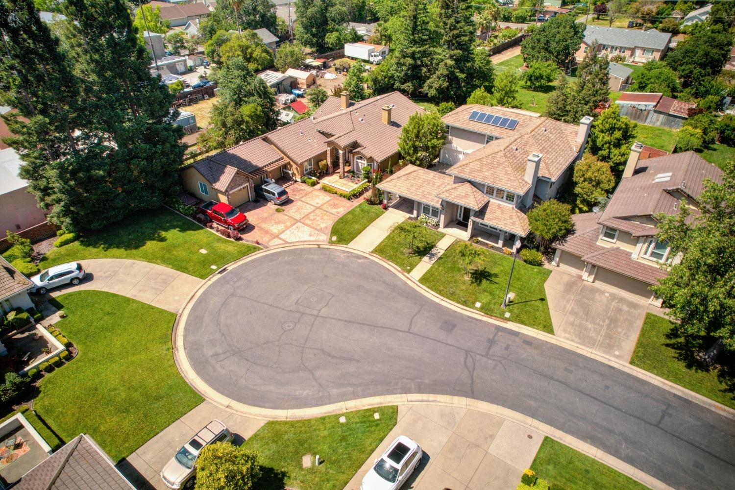 an aerial view of a house with a swimming pool