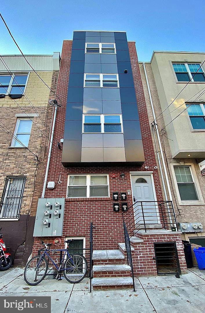 a front view of a building with glass windows