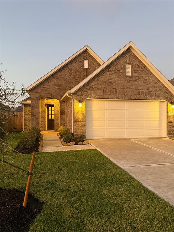 a front view of a house with yard