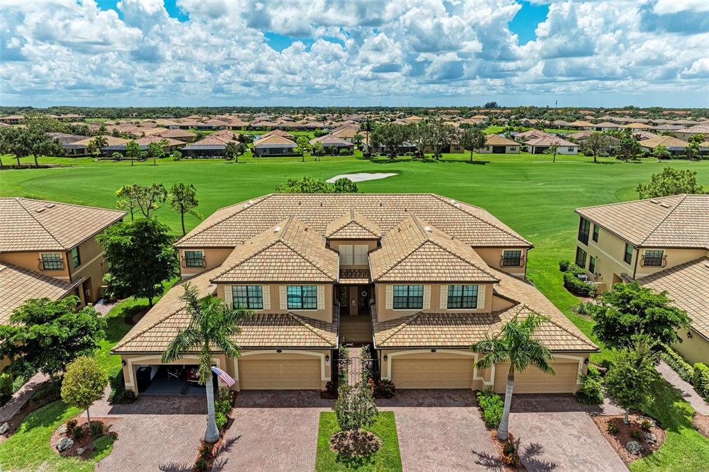 an aerial view of a house with a yard