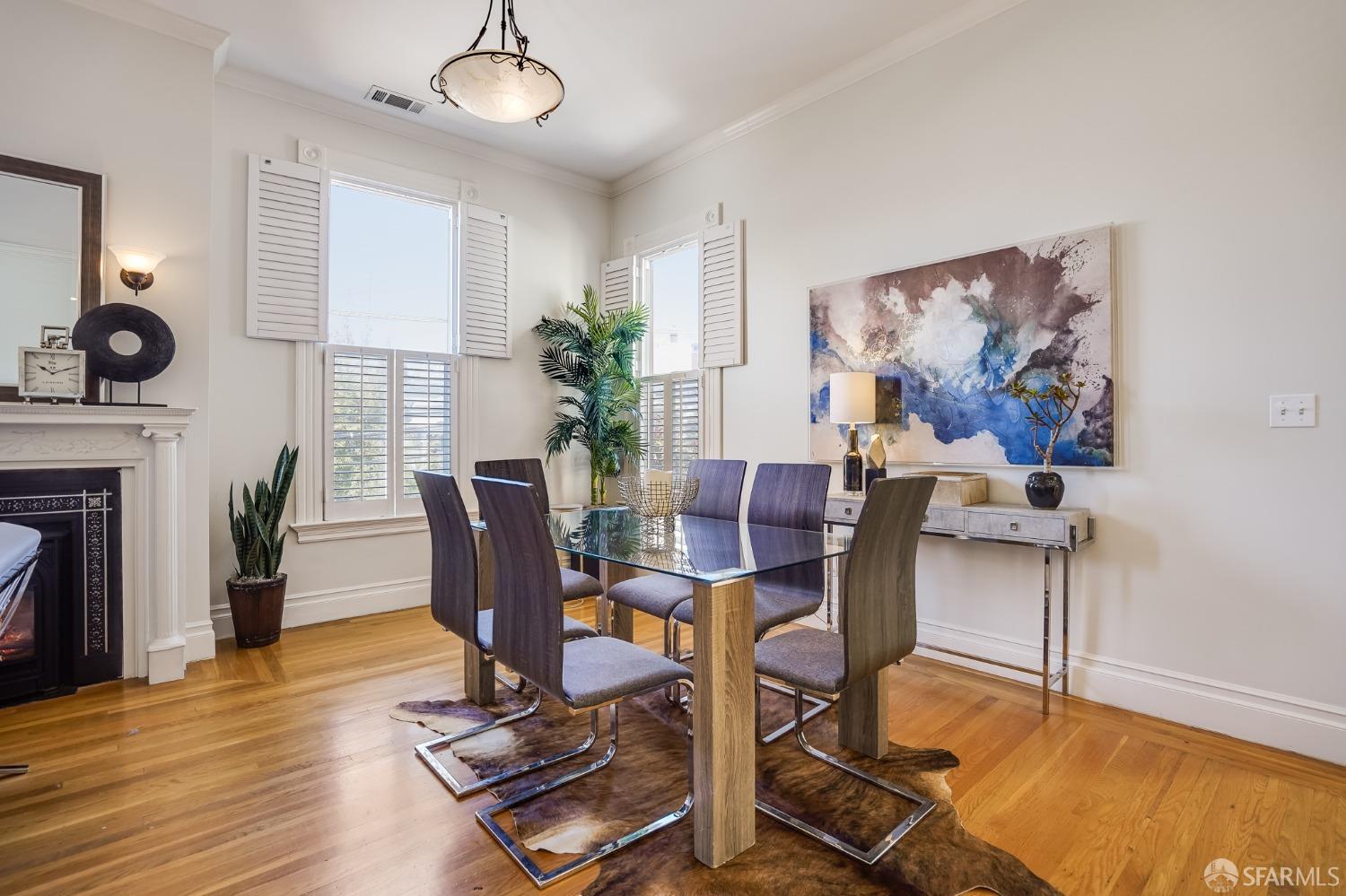 a view of a livingroom with furniture and a potted plant