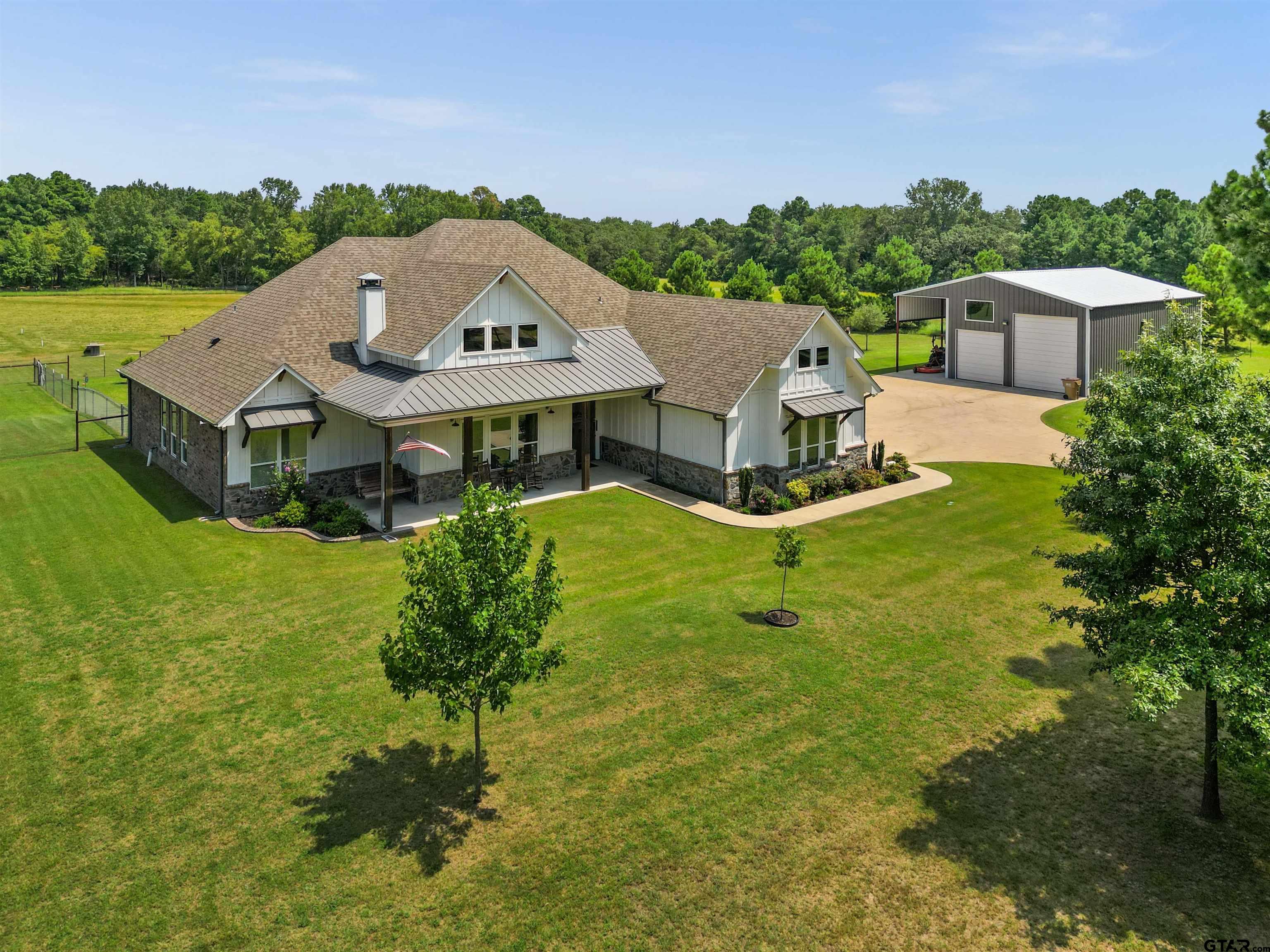 a view of a house with a yard porch and sitting area