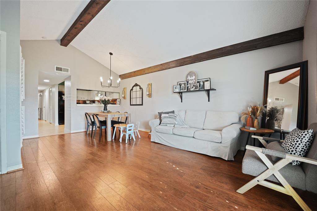 a living room with furniture and a table