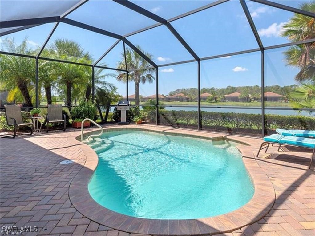 a view of a swimming pool with a yard