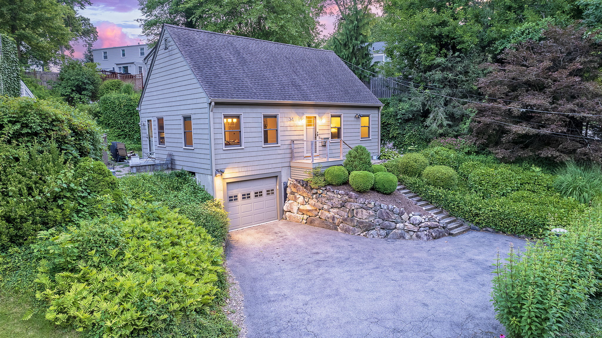 a aerial view of a house with a yard and plants