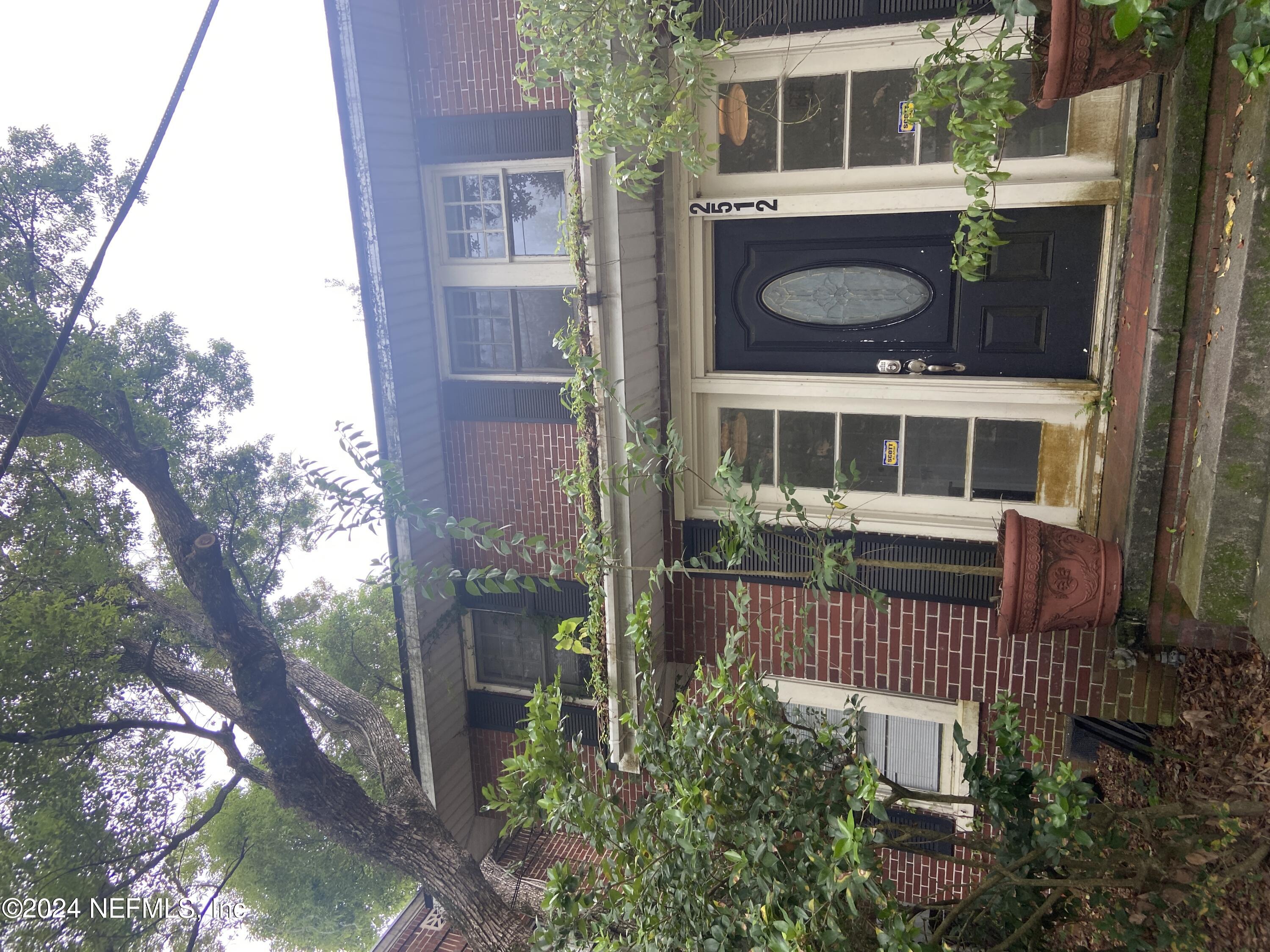 a front view of a house with yard