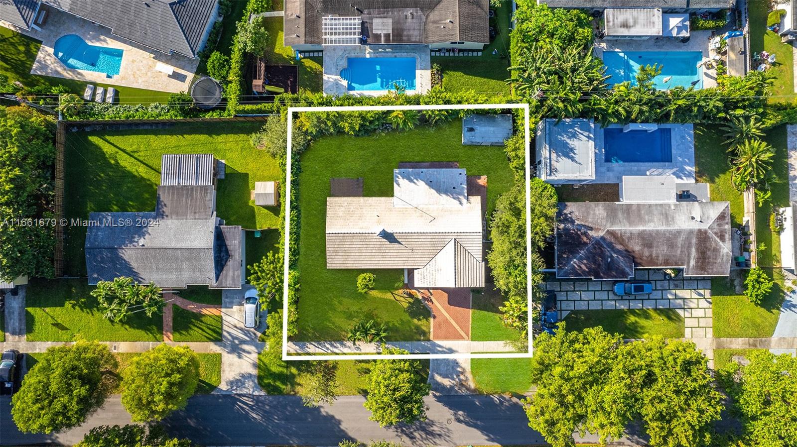 an aerial view of a house with a garden and plants