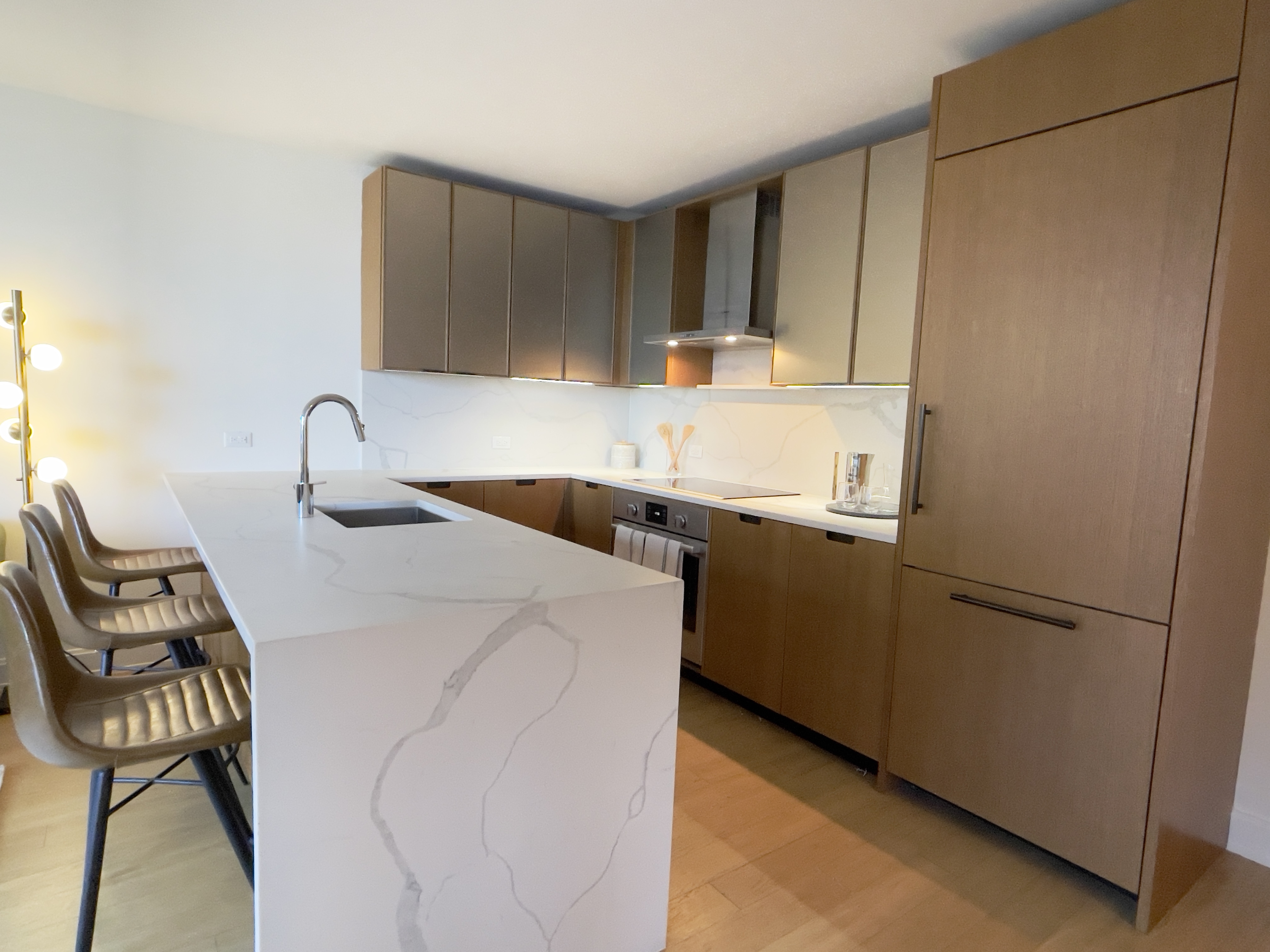 a kitchen with a sink cabinets and appliances