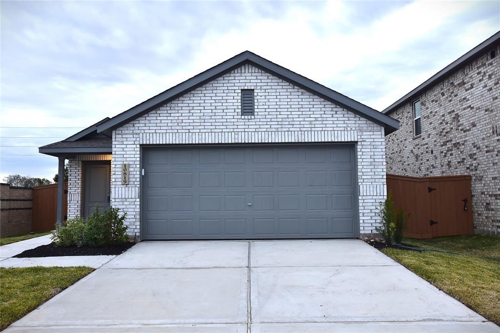 a front view of a house with garage