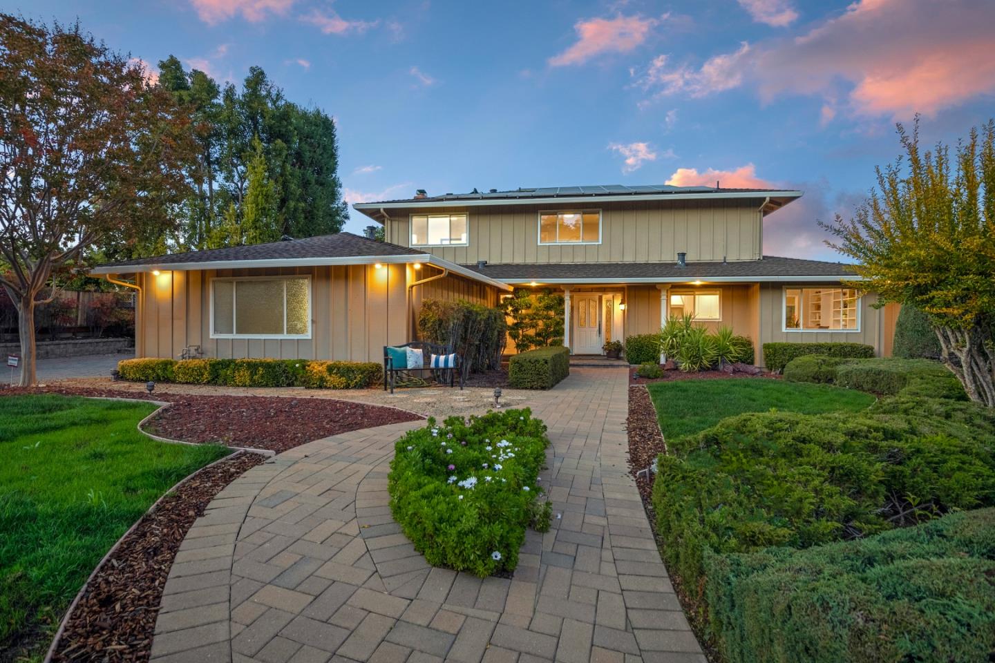 a front view of a house with garden