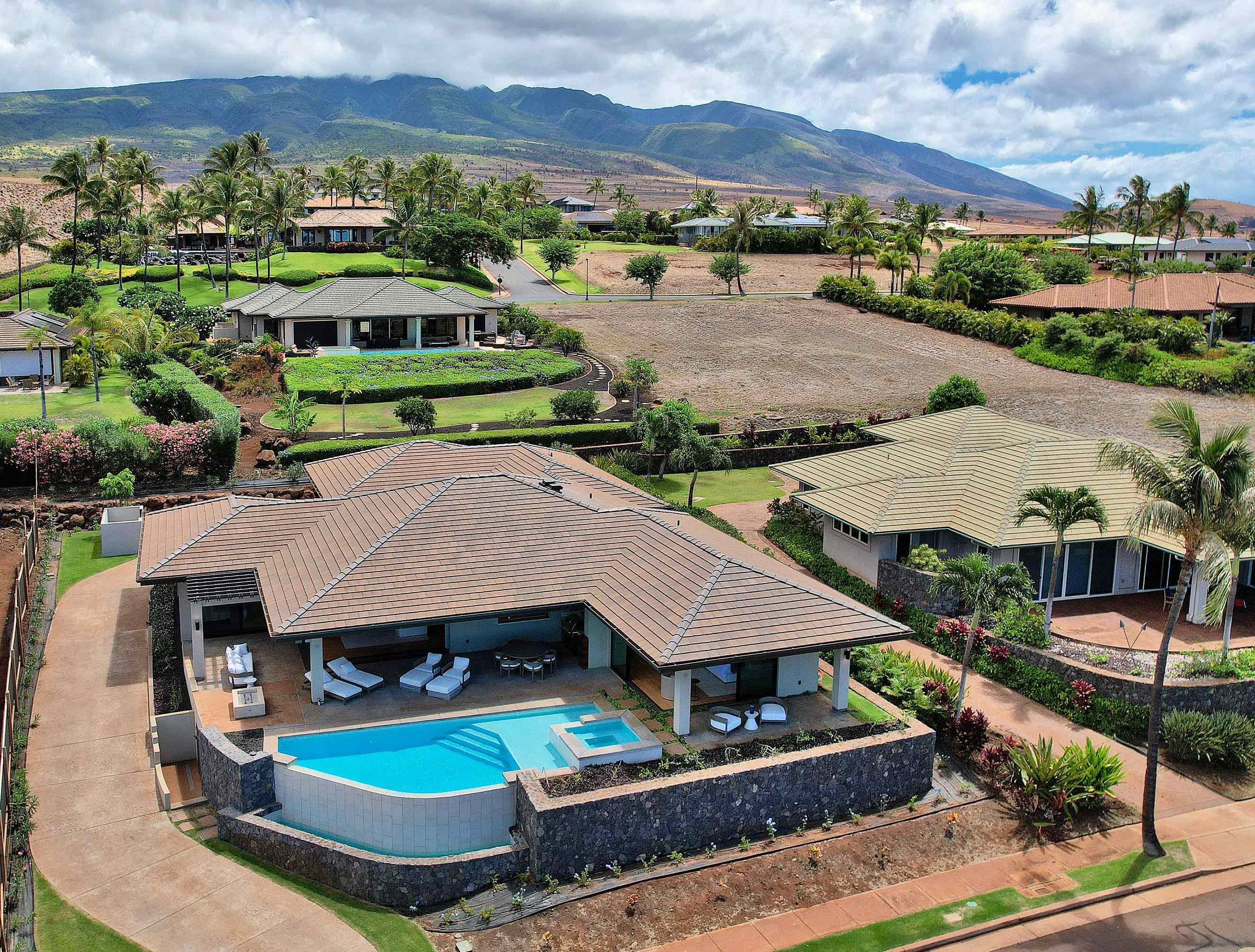 an aerial view of a house with a garden