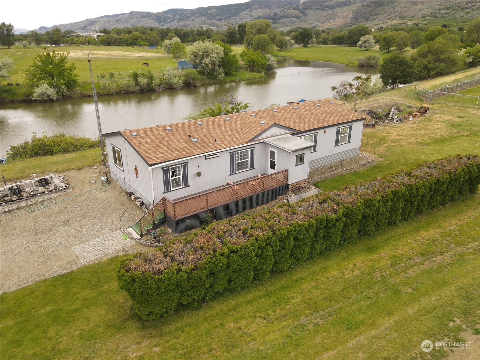 an aerial view of a house with a lake view