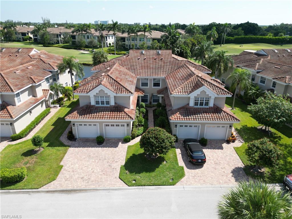 an aerial view of a house with yard swimming pool and outdoor seating