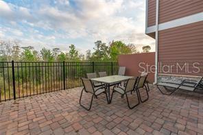 a view of a terrace with furniture