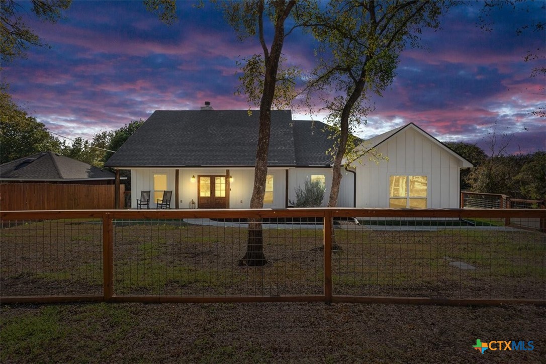 a view of house with yard