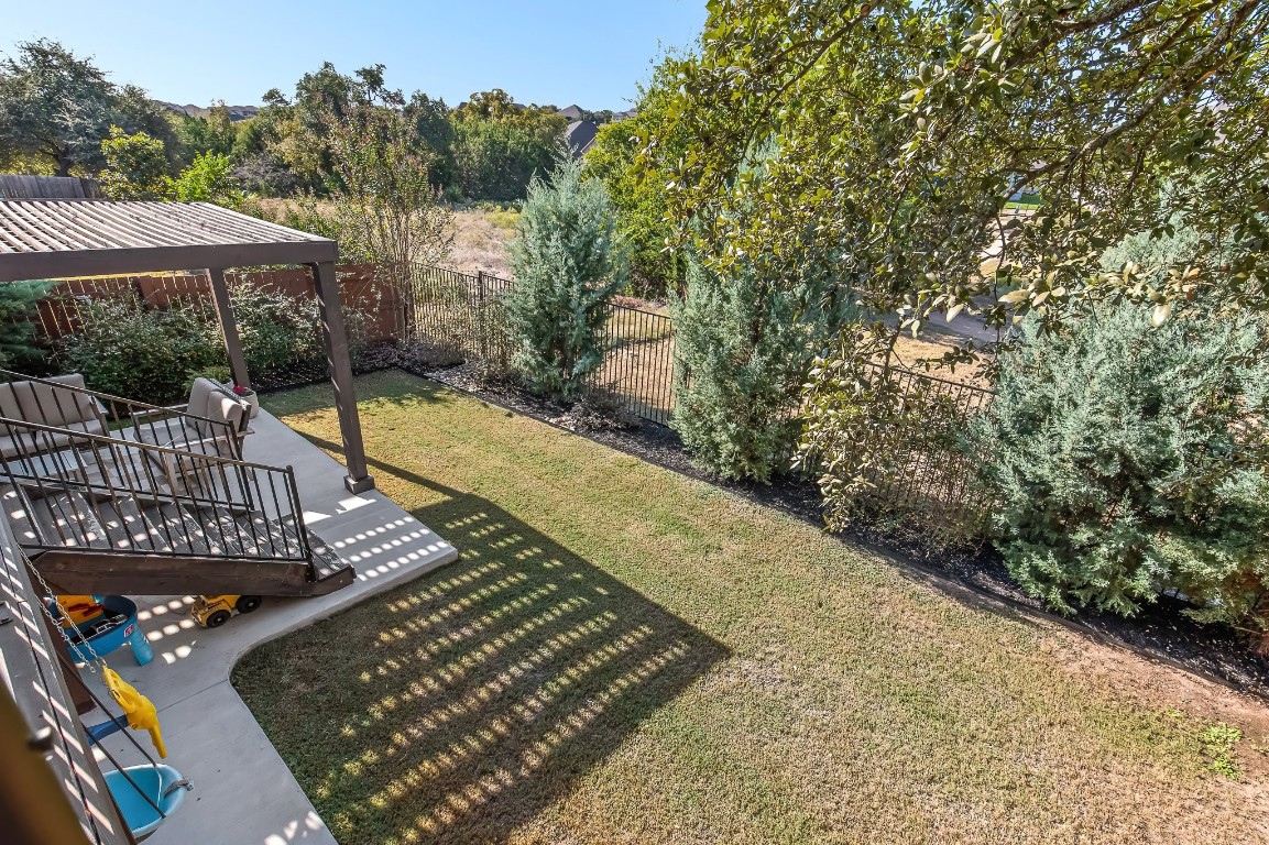 a view of a backyard with sitting area