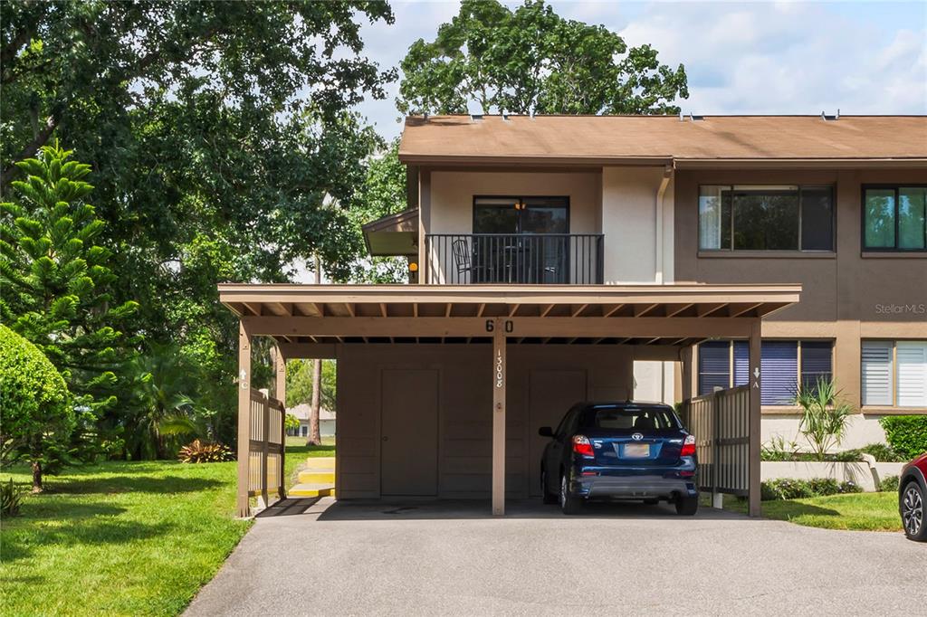 a view of a car park in front of a house