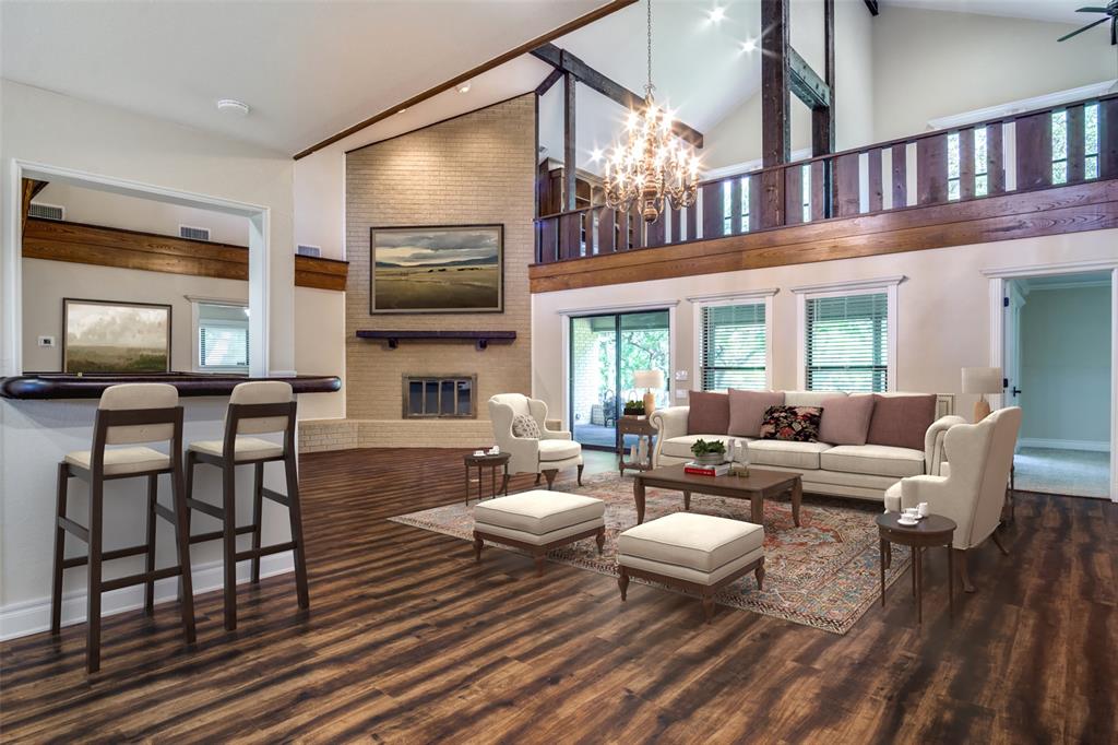 a living room with fireplace furniture and a flat screen tv