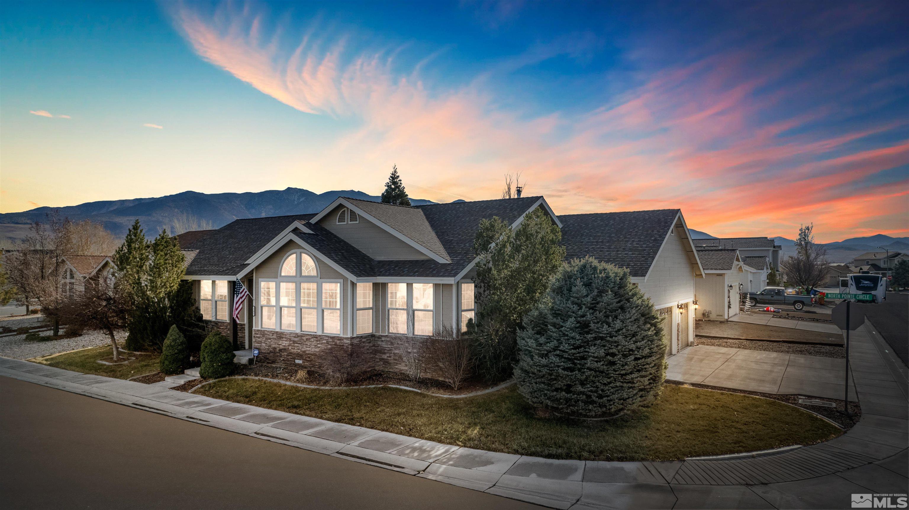 a view of a house with a yard