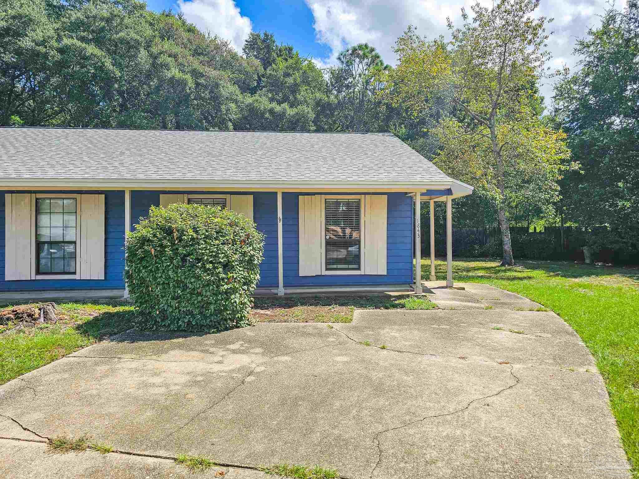 front view of a house with a yard