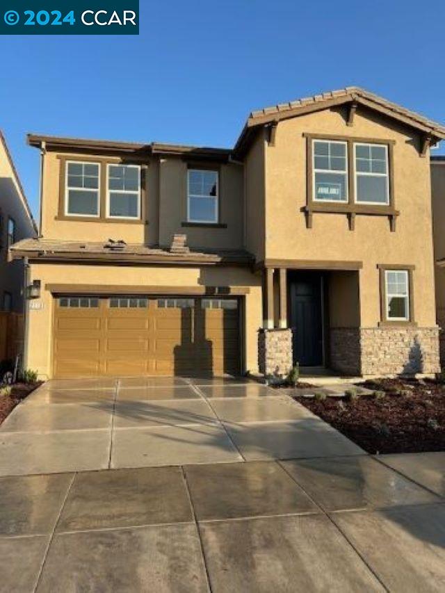 a front view of a house with a garage