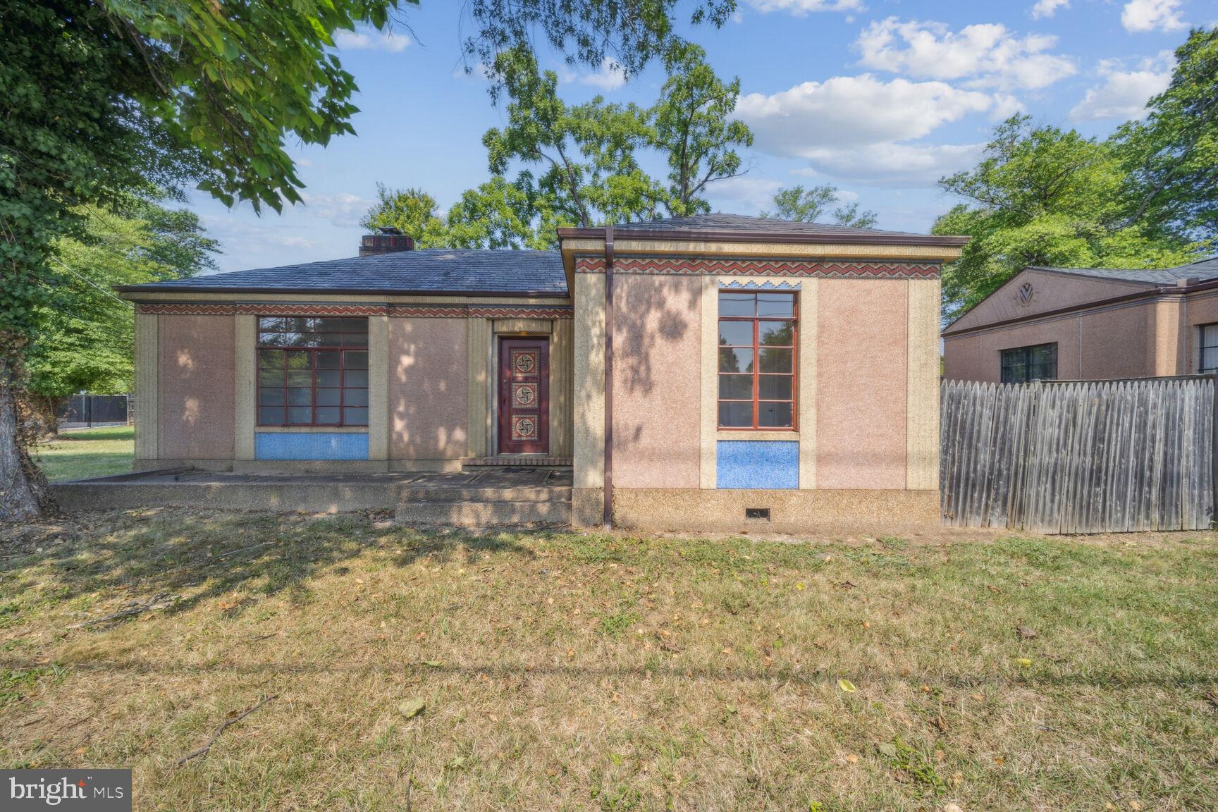 front view of a house with a large window