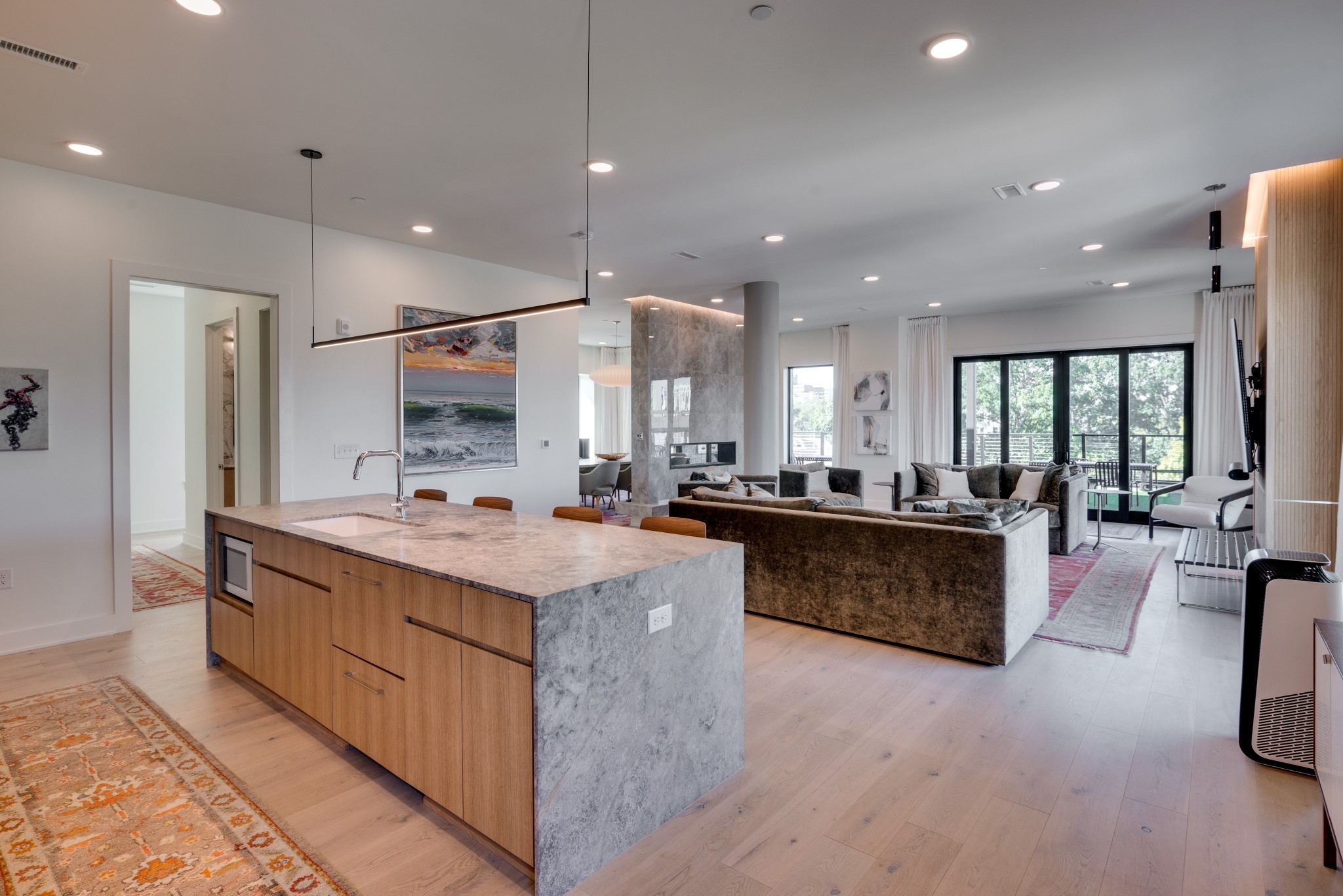 a large kitchen with a large counter top appliances and cabinets