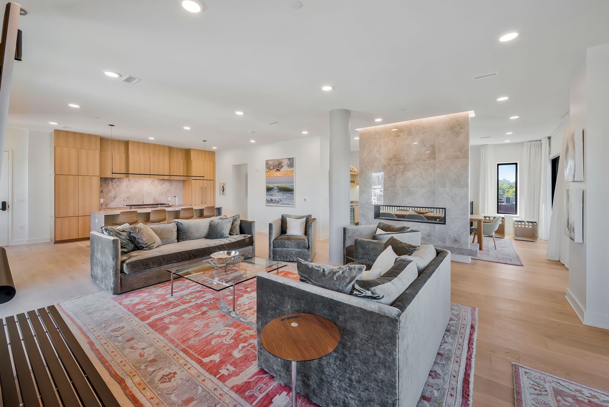 a living room with furniture and a rug