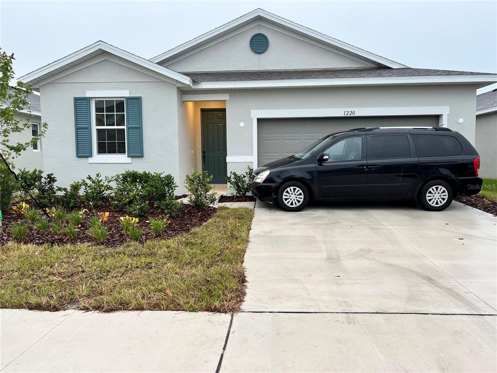 a car parked in front of a house